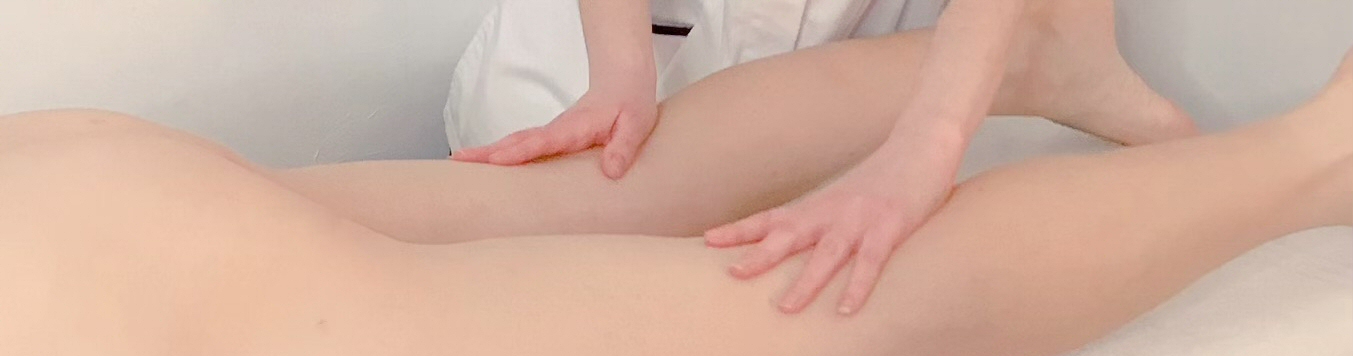 Hands massaging a naked body