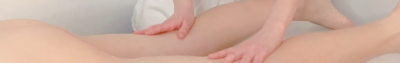 Hands massaging a naked body