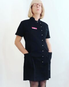 Cheltenham masseuse in black tunic.  Blonde transwoman